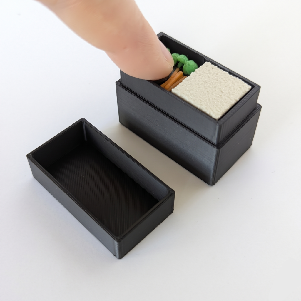 Open Bento Clicker with a finger